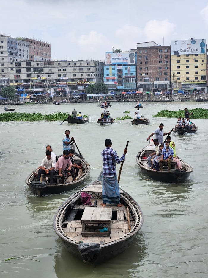 Busy river scene with boats and people on Buriganga River in Dhaka, Bangladesh